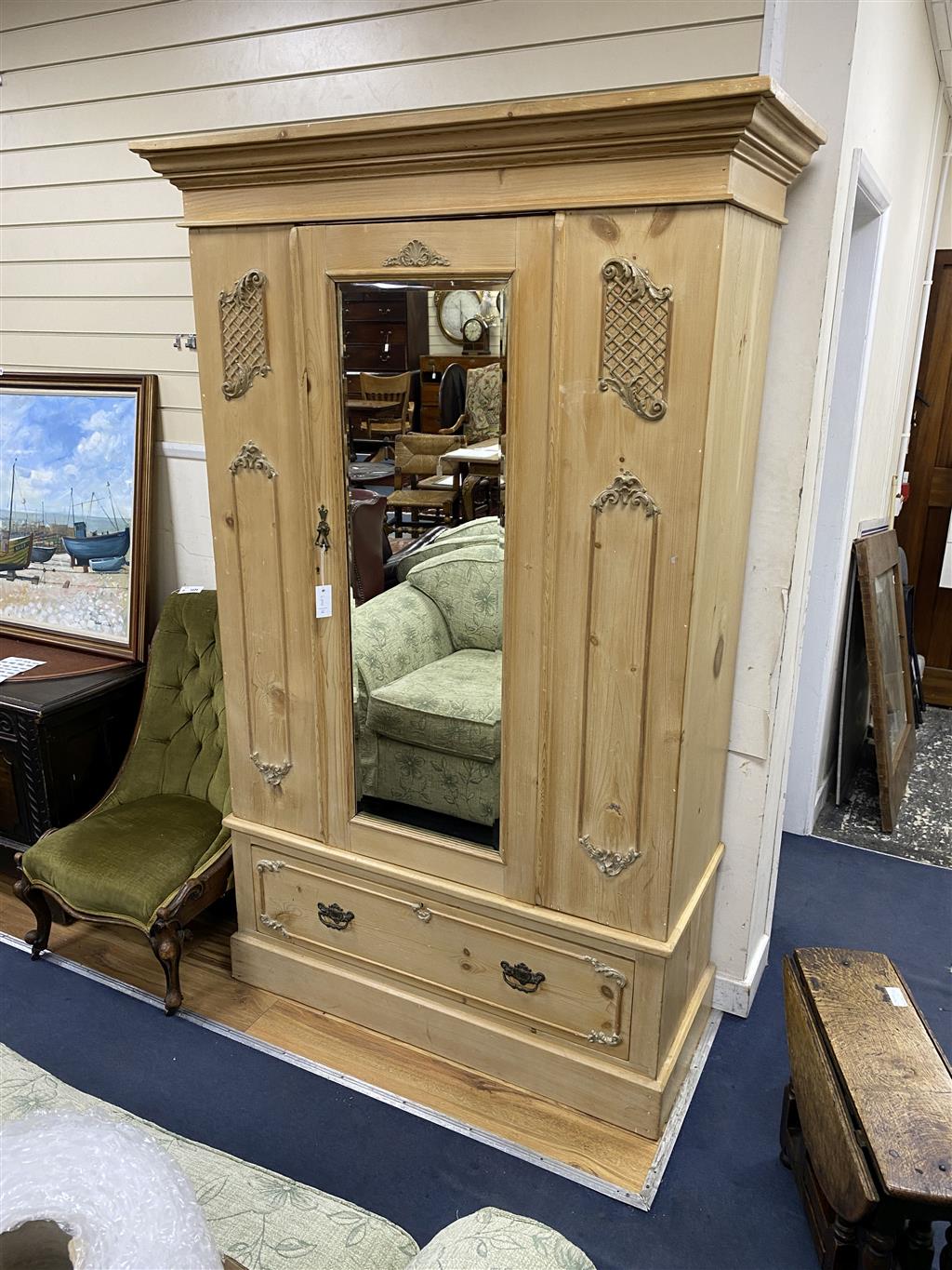 An Edwardian pine mirrored door wardrobe, width 124cm, depth 52cm, height 199cm